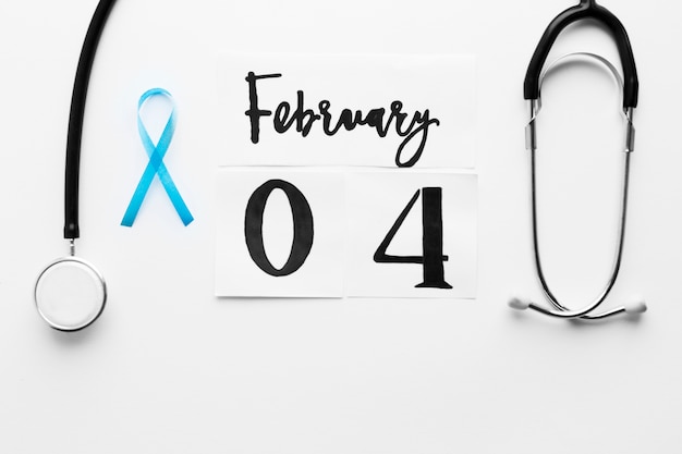 Teal ribbon near stethoscope and date