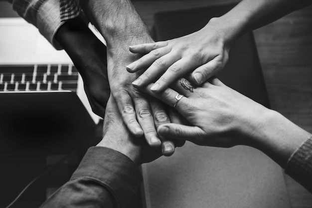 Free photo team of business people stacking hands