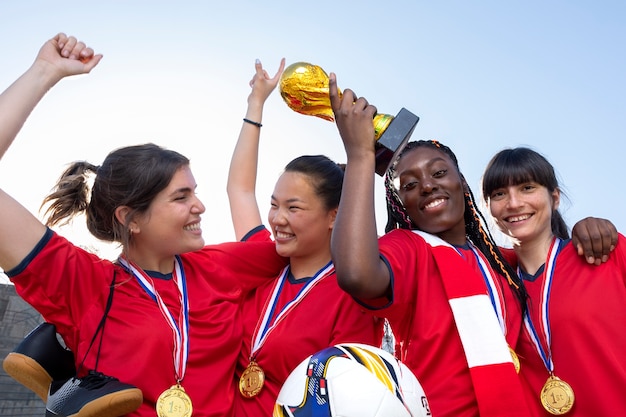 Free photo team celebrating the win of silver cup