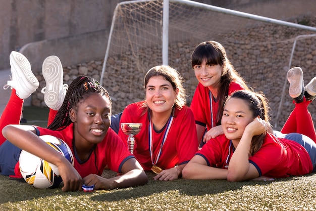 Free photo team celebrating the win of silver cup