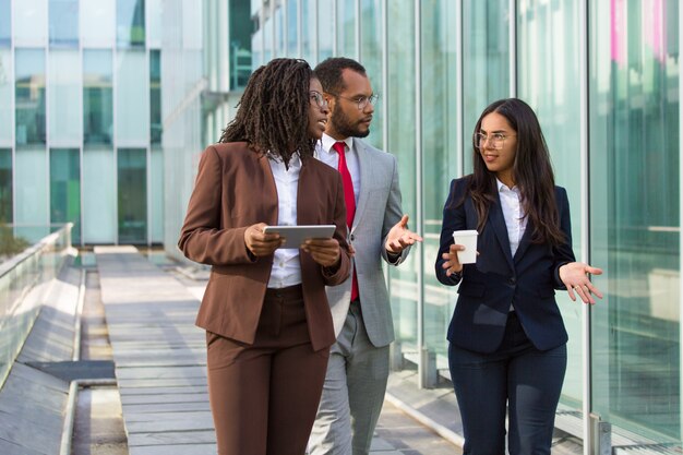 Team of diverse colleagues on their way to office