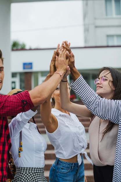 Free photo team giving high five