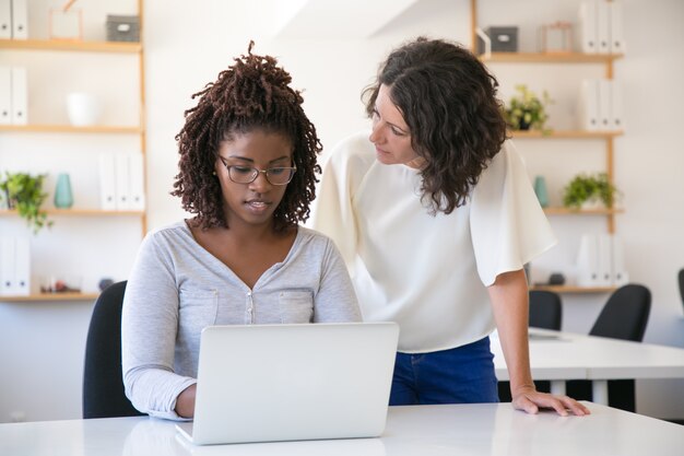 Team leader asking employee about report