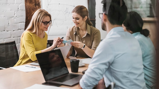 Team of smiley businesspeople during a meeting presentation