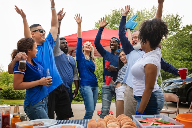 Team supporters celebrating at a tailgate party