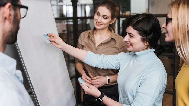 Team of young professional businesspeople during a meeting presentation