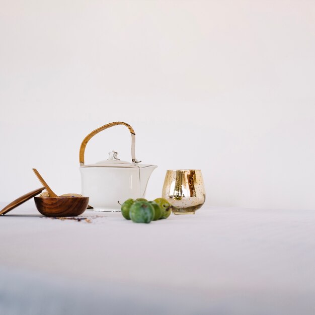 Teapot in arrangement with fruit