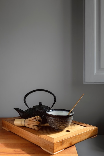 Teapot and tea set on wooden tray