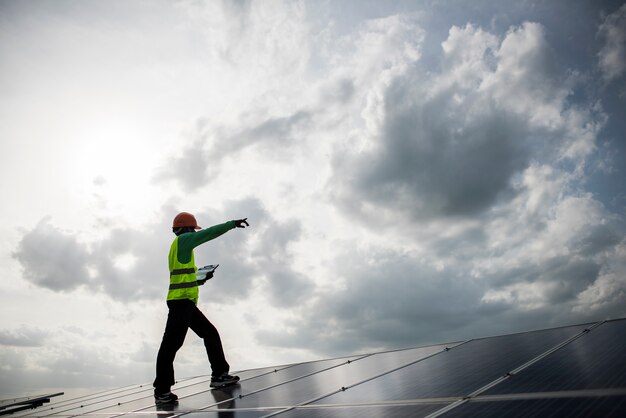 Technician engineer checks the maintenance of the solar cell panels.