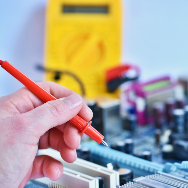 Technician fixing the motherboard