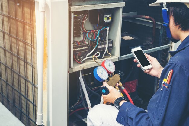 Technician is checking air conditioner