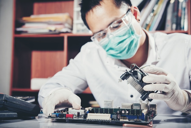 The technician repairing the computer,computer hardware, repairing, upgrade and technology