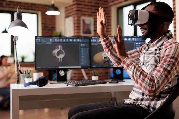 Free Photo technician with vr glasses developing industrial product on manufacturing cad software on computer. male freelancer working with augmented reality headset to create engine gears construction.
