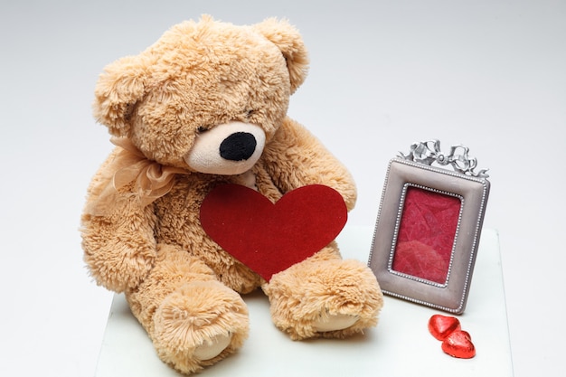 Teddy Bears couple with red heart. Valentines Day concept.