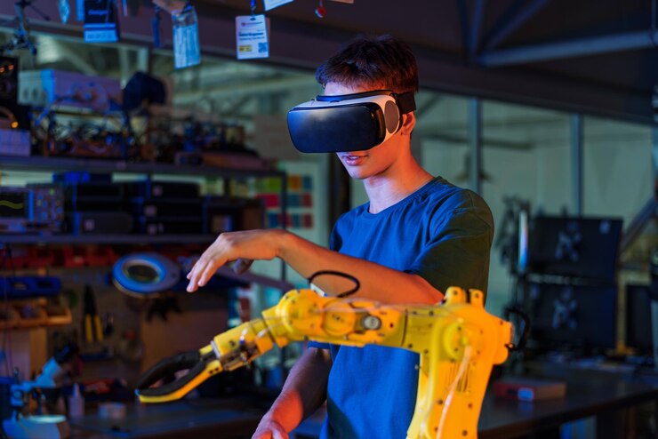 Free Photo teen doing experiments in robotics in a laboratory boy in vr headset controlling the robot