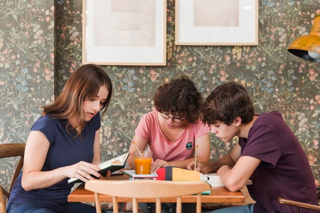 teen friends studying in cafe