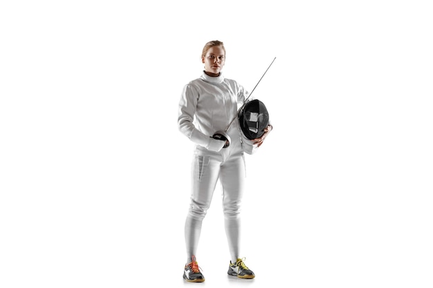 Teen girl in fencing costume with sword in hand isolated on white  background.