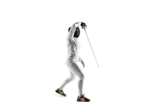 Teen girl in fencing costume with sword in hand isolated on white  background.