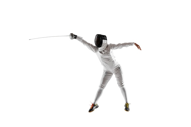 Free photo teen girl in fencing costume with sword in hand isolated on white studio background.