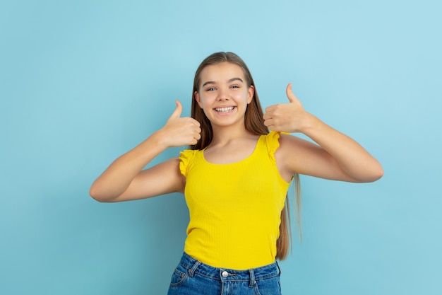 Teen girl showing thumbs up