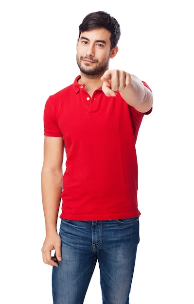 Teen pointing at something on white background