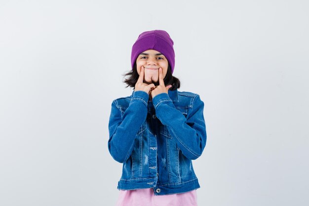 Teen woman in checkered shirt and beanie gesticulating isolated