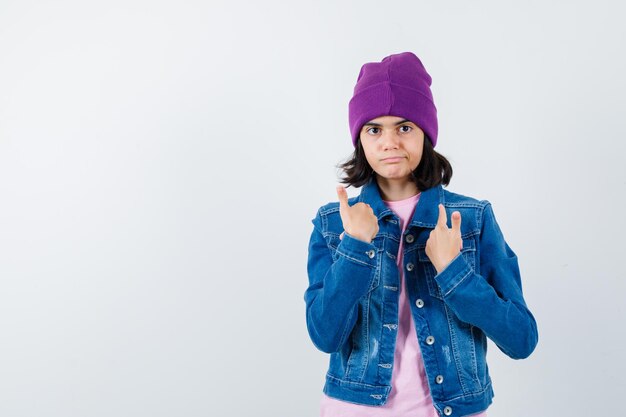 Teen woman in checkered shirt and beanie gesticulating isolated