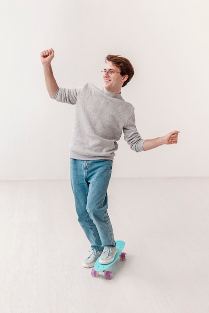 Teenage boy riding skateboard