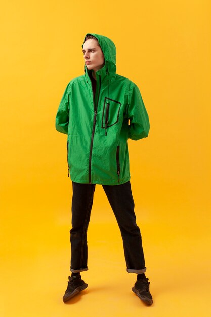 Teenage boy wearing green jacket