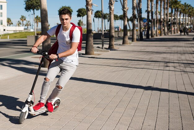 Teenage boy with scooter