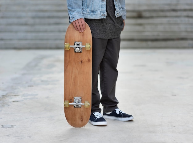 Teenage boy with skateboard close up