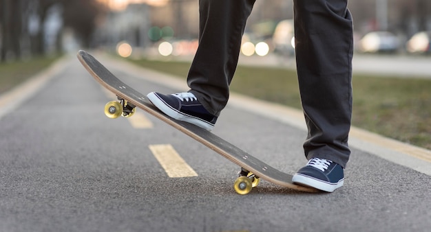 Teenage boy with skateboard close up