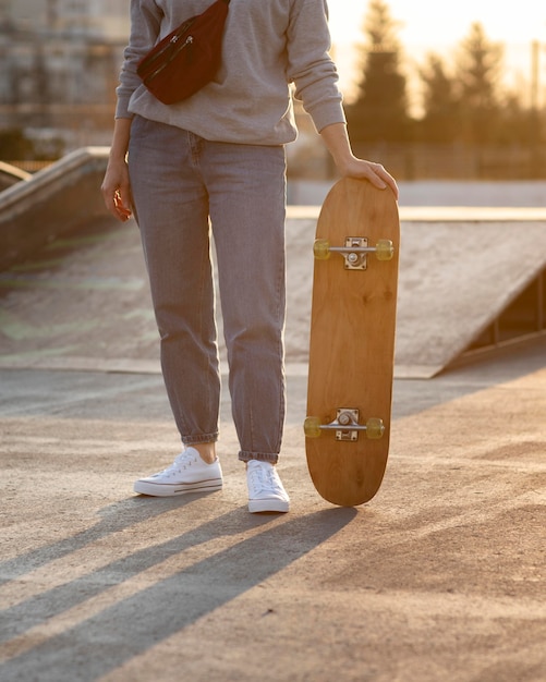 Teenage boy with skateboard close up