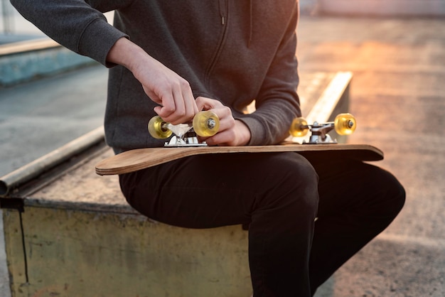 Teenage boy with skateboard close up