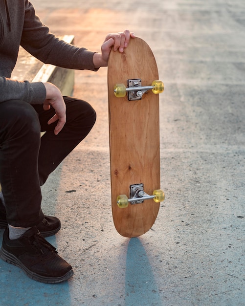 Teenage boy with skateboard close up