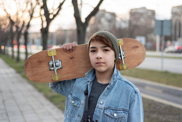 Teenage boy with skateboard
