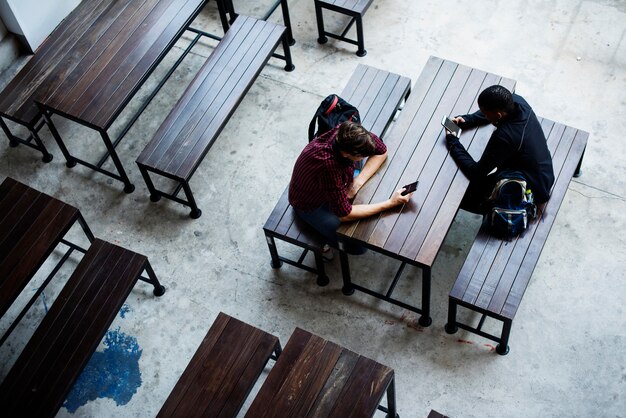 Teenage boys sitting together in a empty canteen