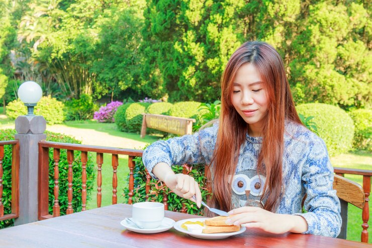 Free Photo teenage eating breakfast