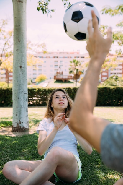 Free photo teenage friends playing with soccer ball