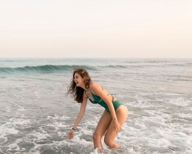 Teenage girl having fun at sea