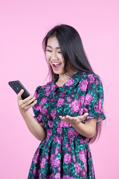 Teenage girl showing phone and facial emotions