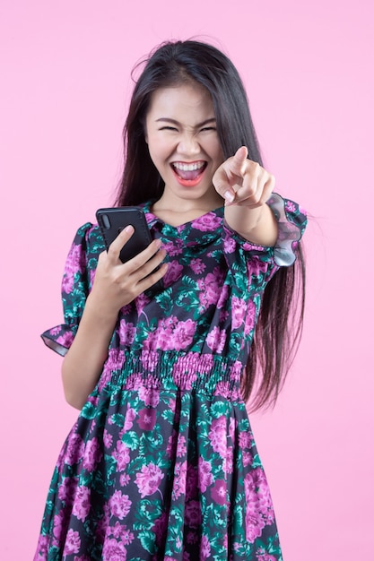 Teenage girl showing phone and facial emotions