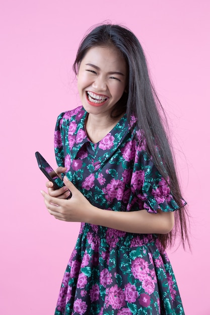 Teenage girl showing phone and facial emotions