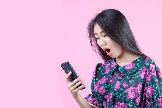 Teenage girl showing phone and facial emotions