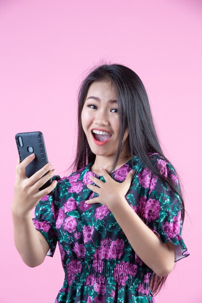 Teenage girl showing phone and facial emotions