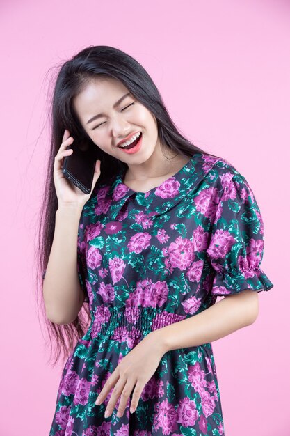 Teenage girl showing phone and facial emotions