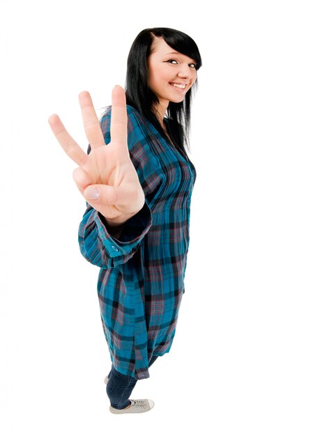 Teenage girl showing three fingers