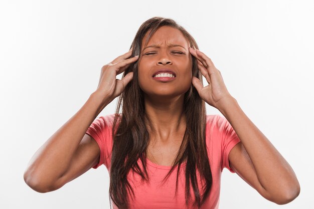 Free photo teenage girl suffering from headache against white background