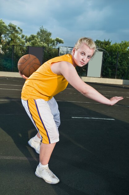 Teenage girl with basketball