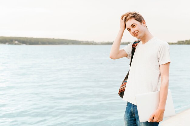 Teenager boy by the lake 